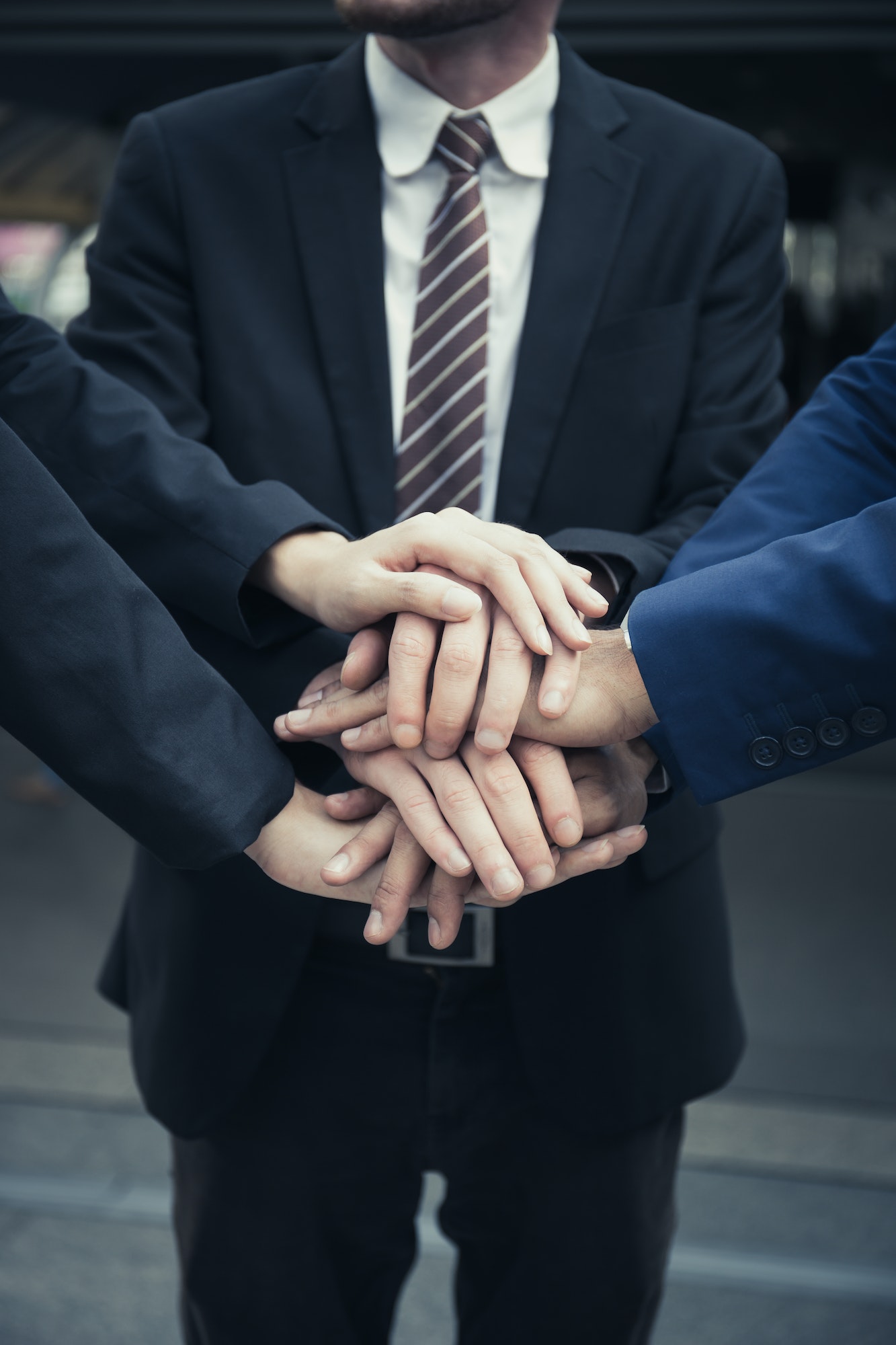 Group of Business.Team with hands together. People with business team stacking hands together.